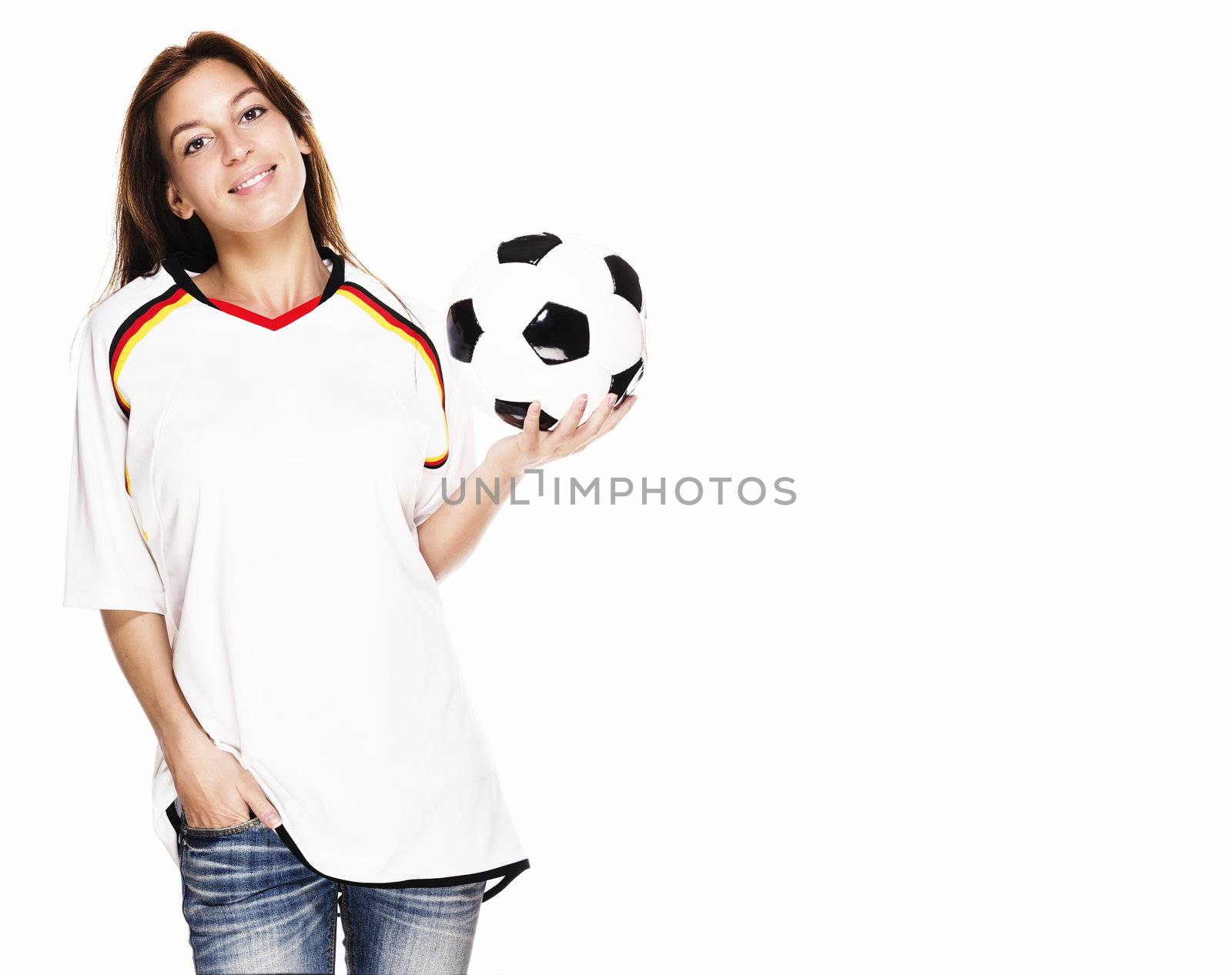 smiling woman wearing football shirt presenting a football on white background