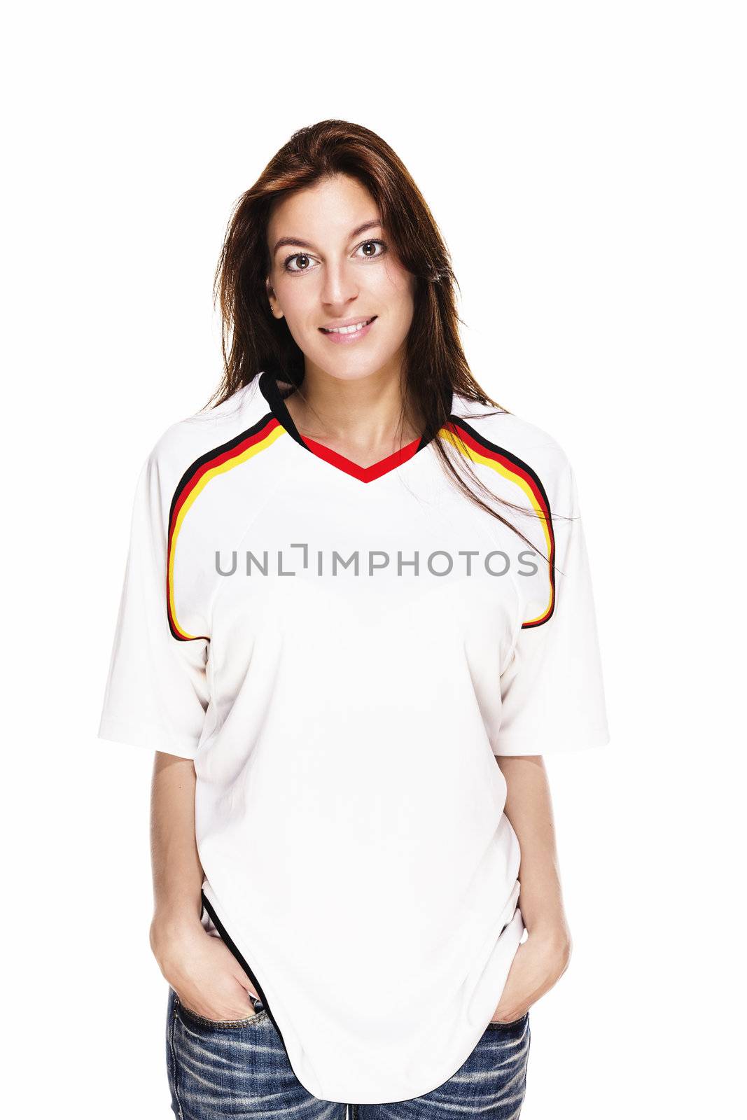 smiling woman wearing football shirt with hands in her pockets by RobStark