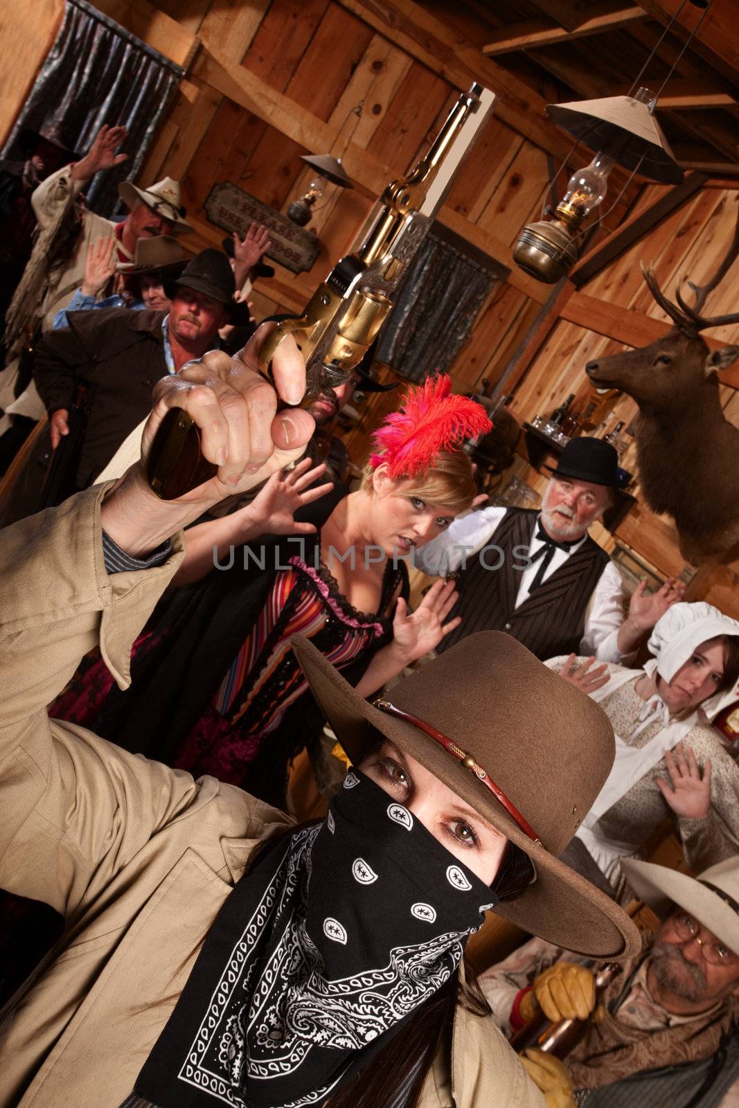 Dangerous female bandit holds up people in old west saloon