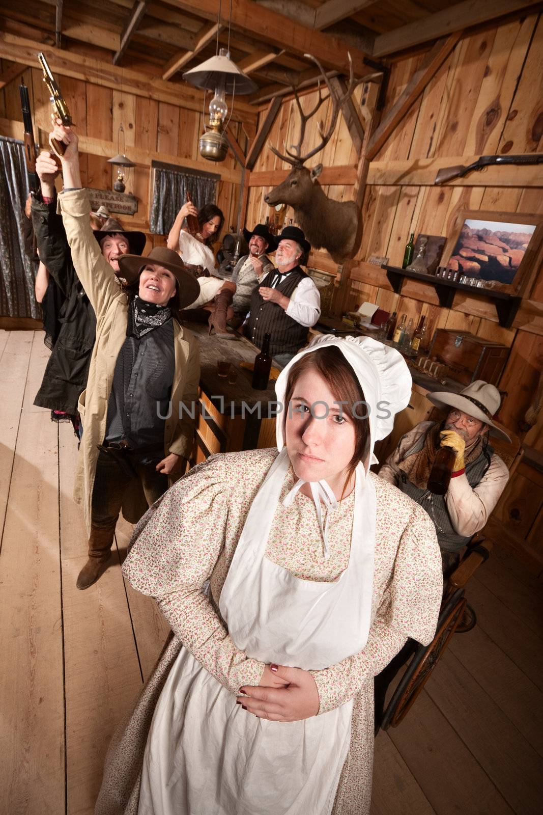 Modest young woman with group of drunks in saloon