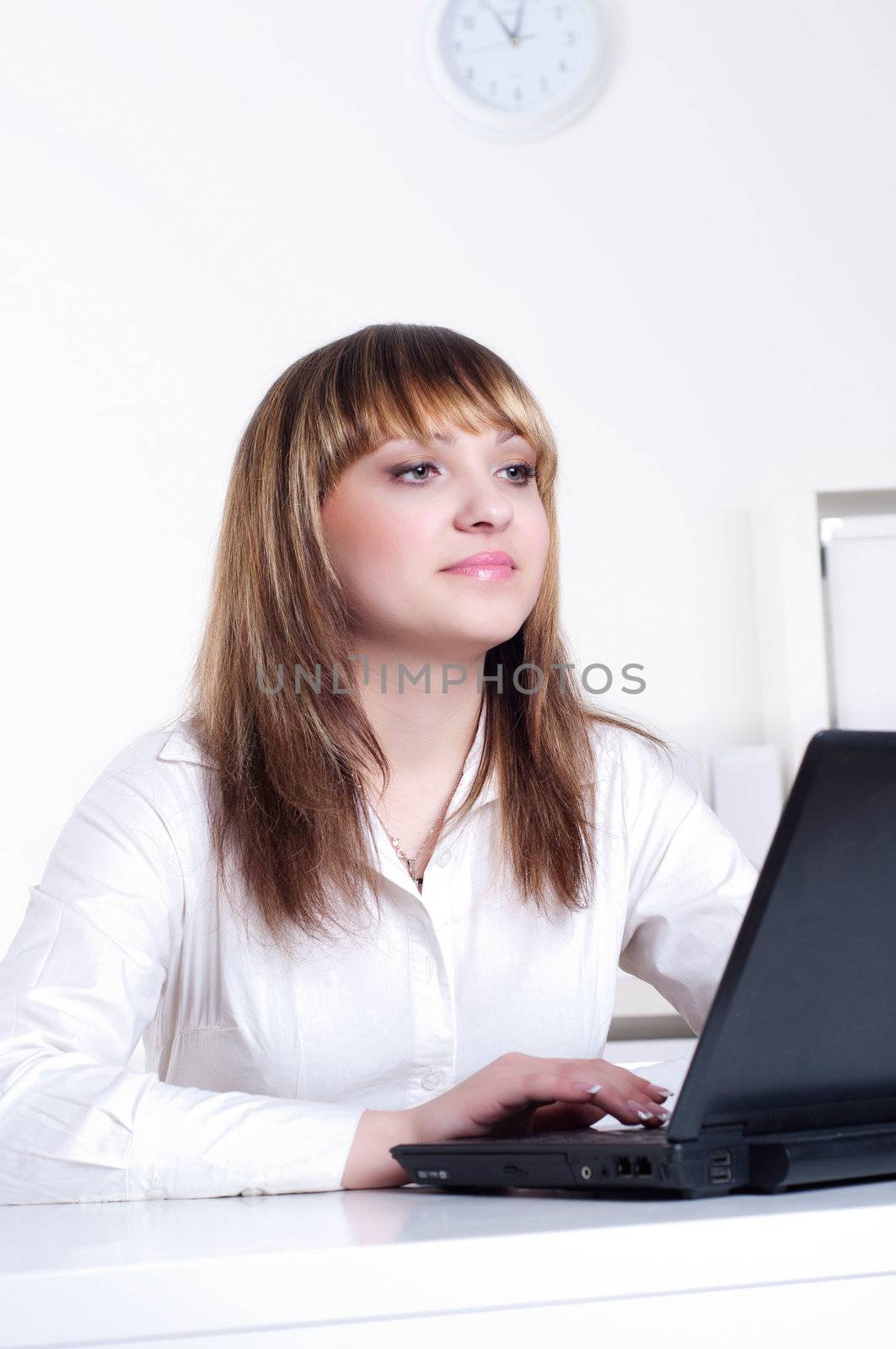 Young busines woman with notebook, in office