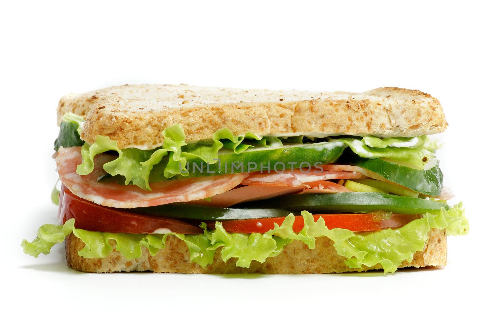 Grand  Sandwich with ham, lettuce, cucumber, tomato and salad isolated on white background