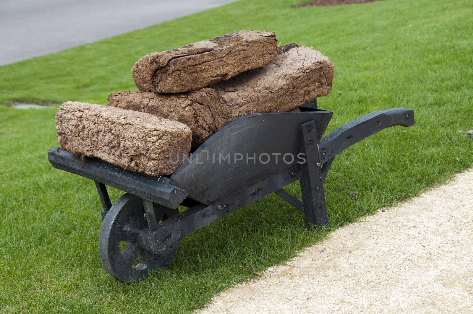 landscape with wheelbarrow with peat