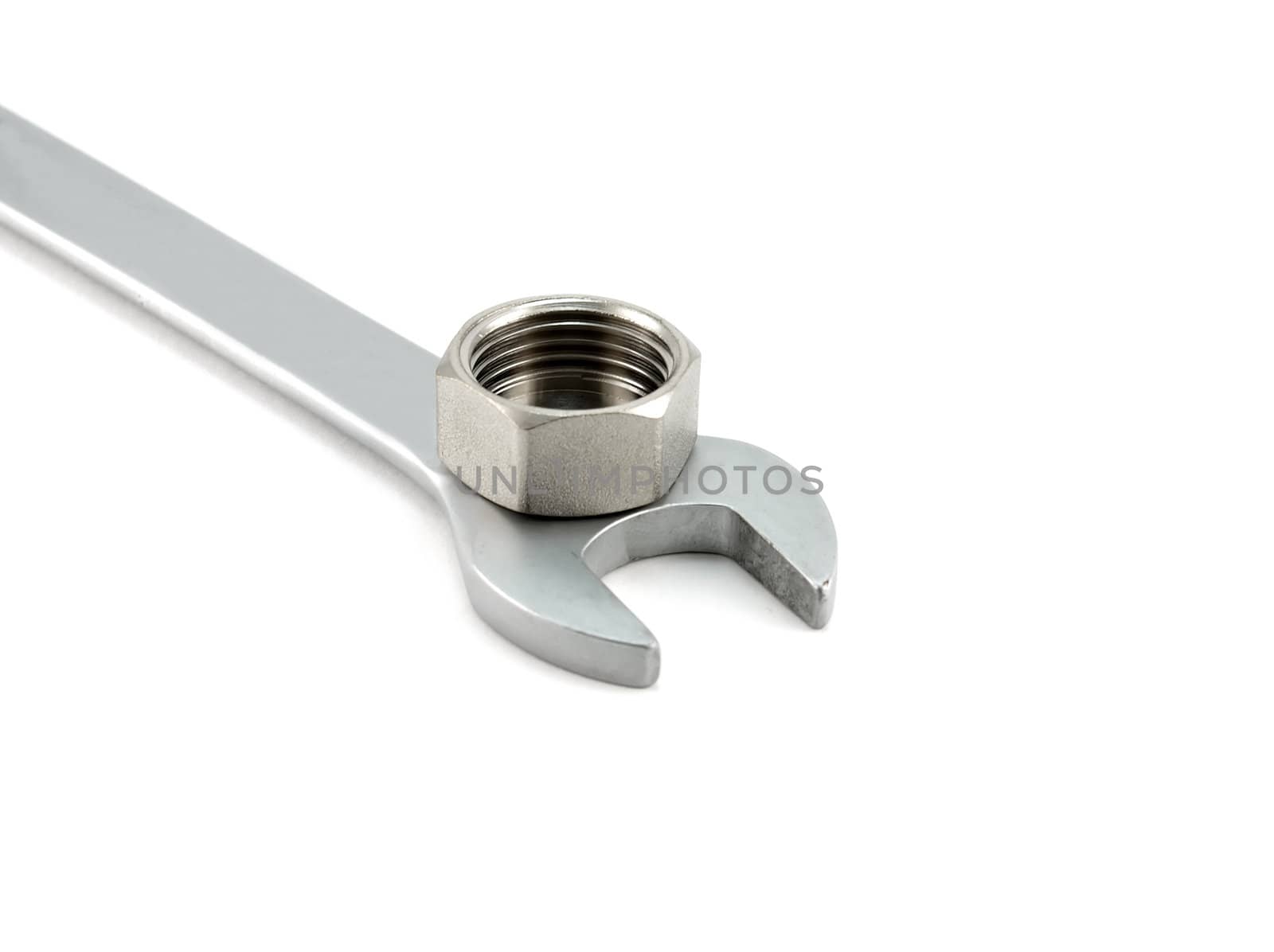 Spanner and female screw over white