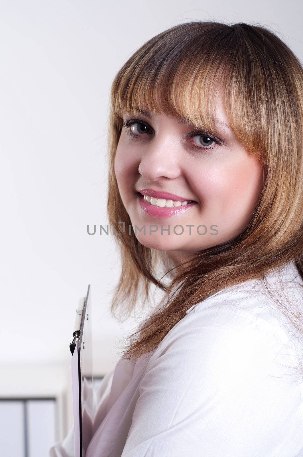 cute woman with tablet in office, portrait