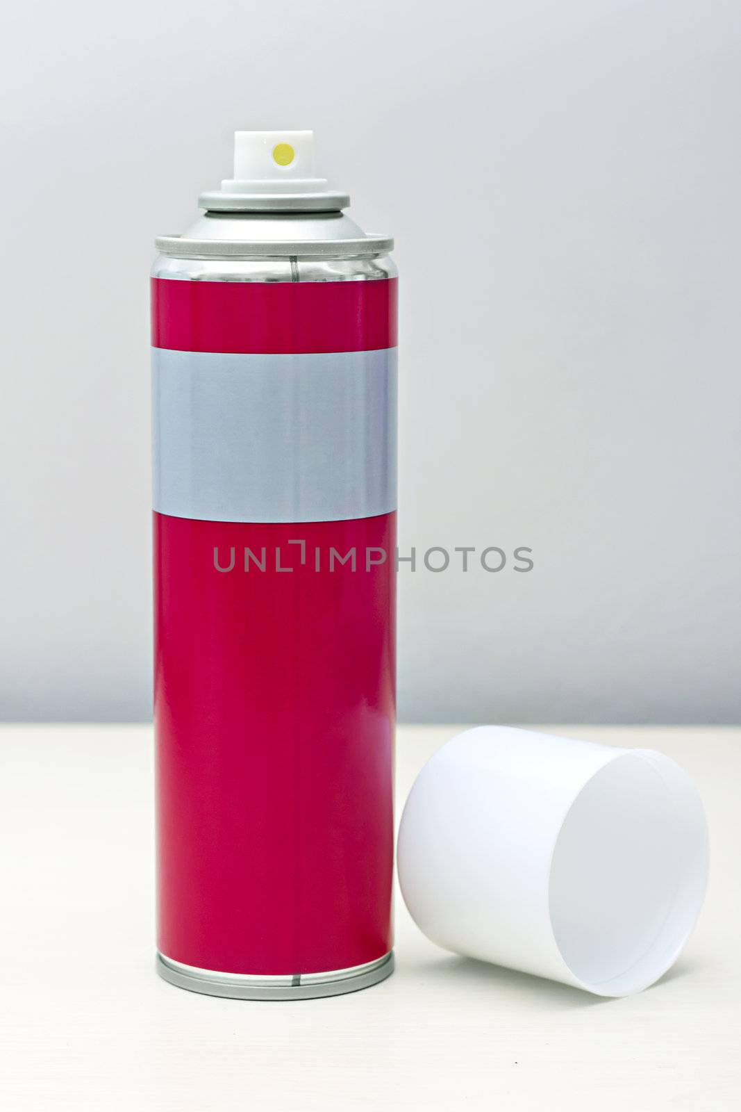 image reddish gray with a white spray can lid