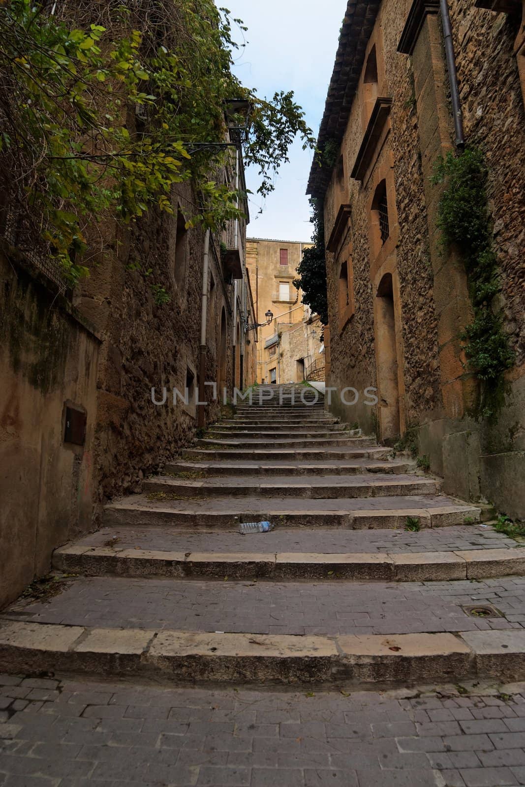 Narrow street with staircase in Piazza Armerina town, Sicily, Italy