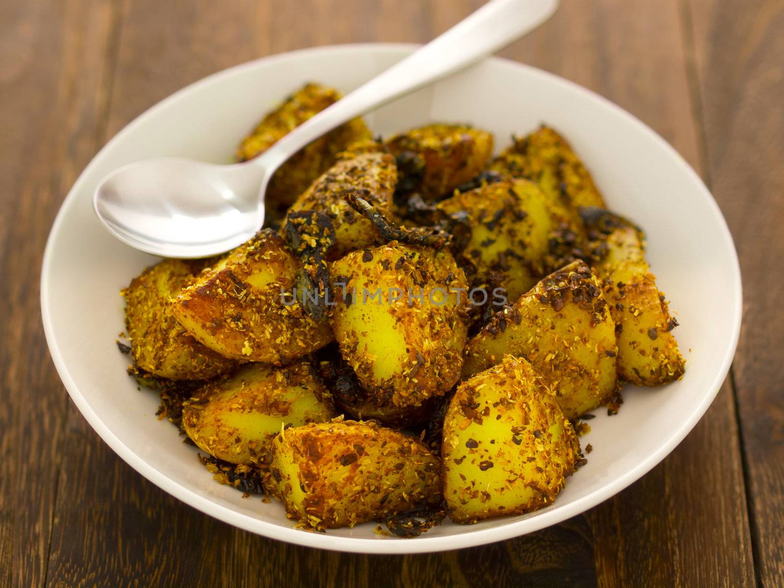 close up of a bowl of crusty baked potatoes