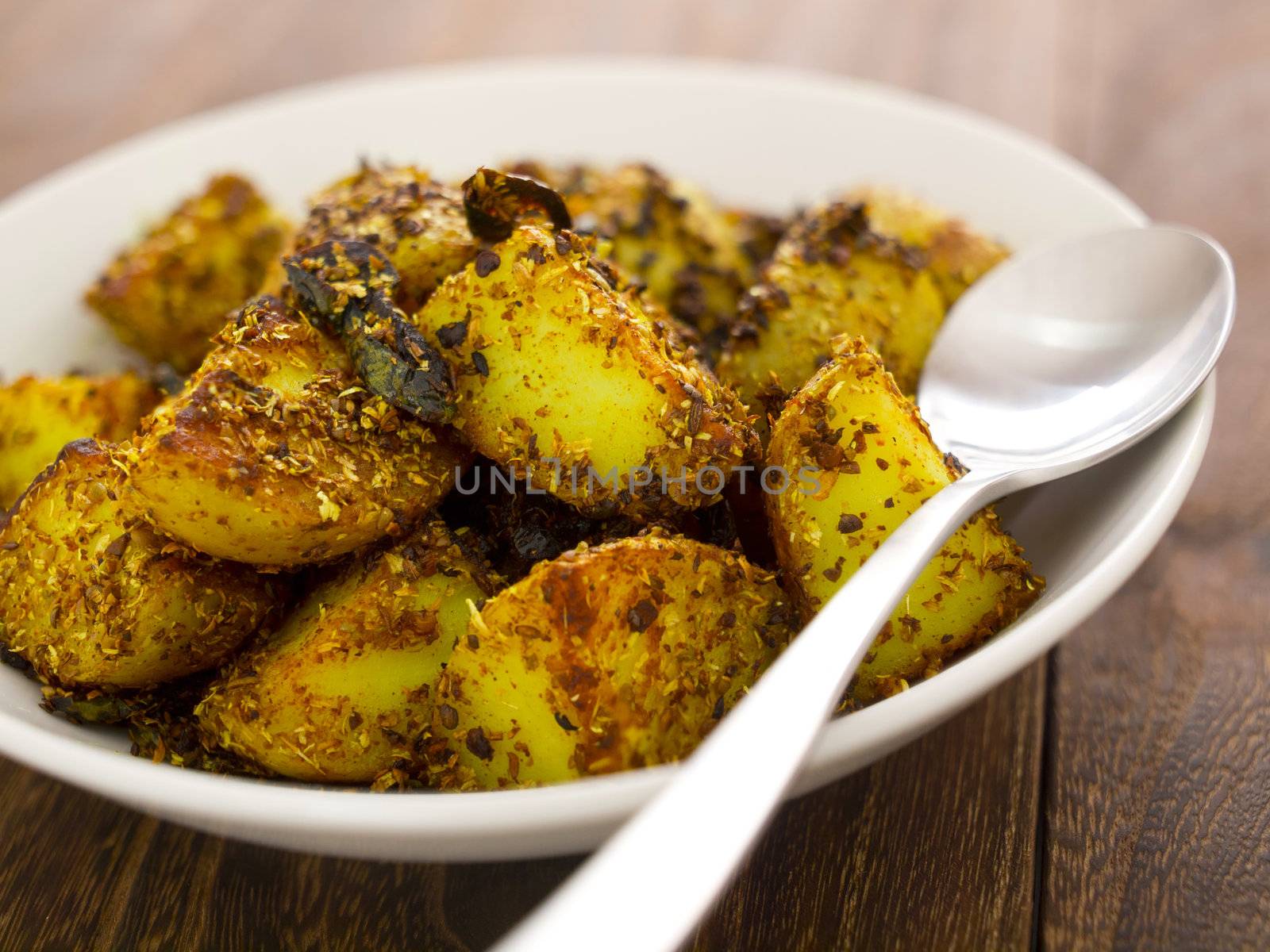 close up of a bowl of crusty baked potatoes