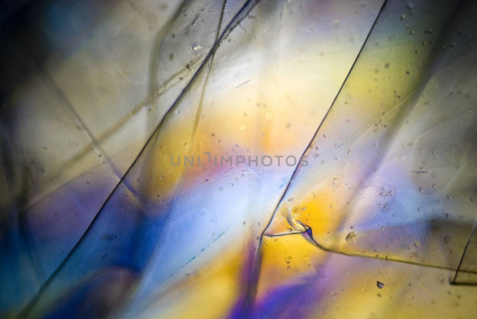 light graphics: microphoto of wrapped plastic foil in polarized light