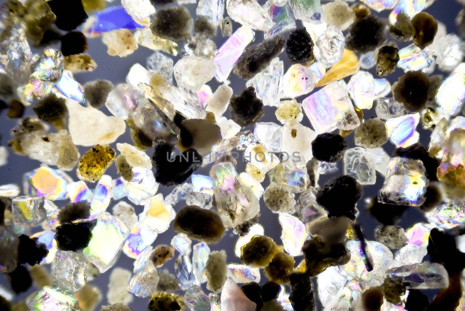 micro photo: grain of sand in polarized light