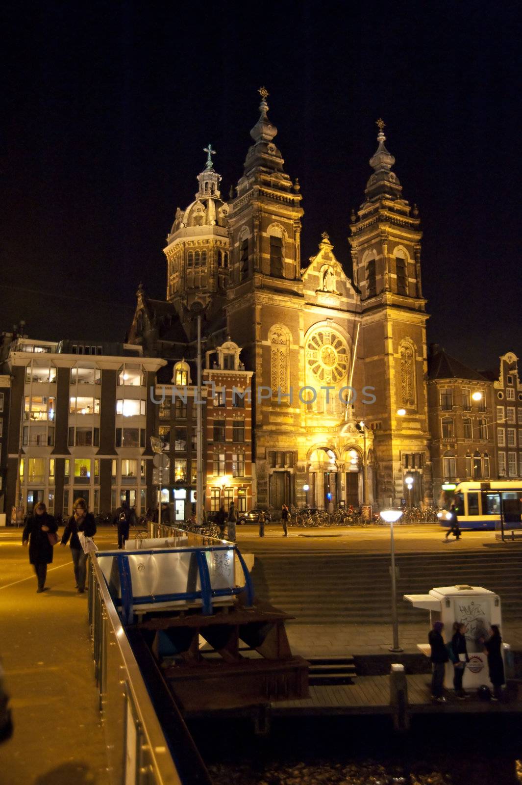 scene in the old town of amsterdam, netherlands by night