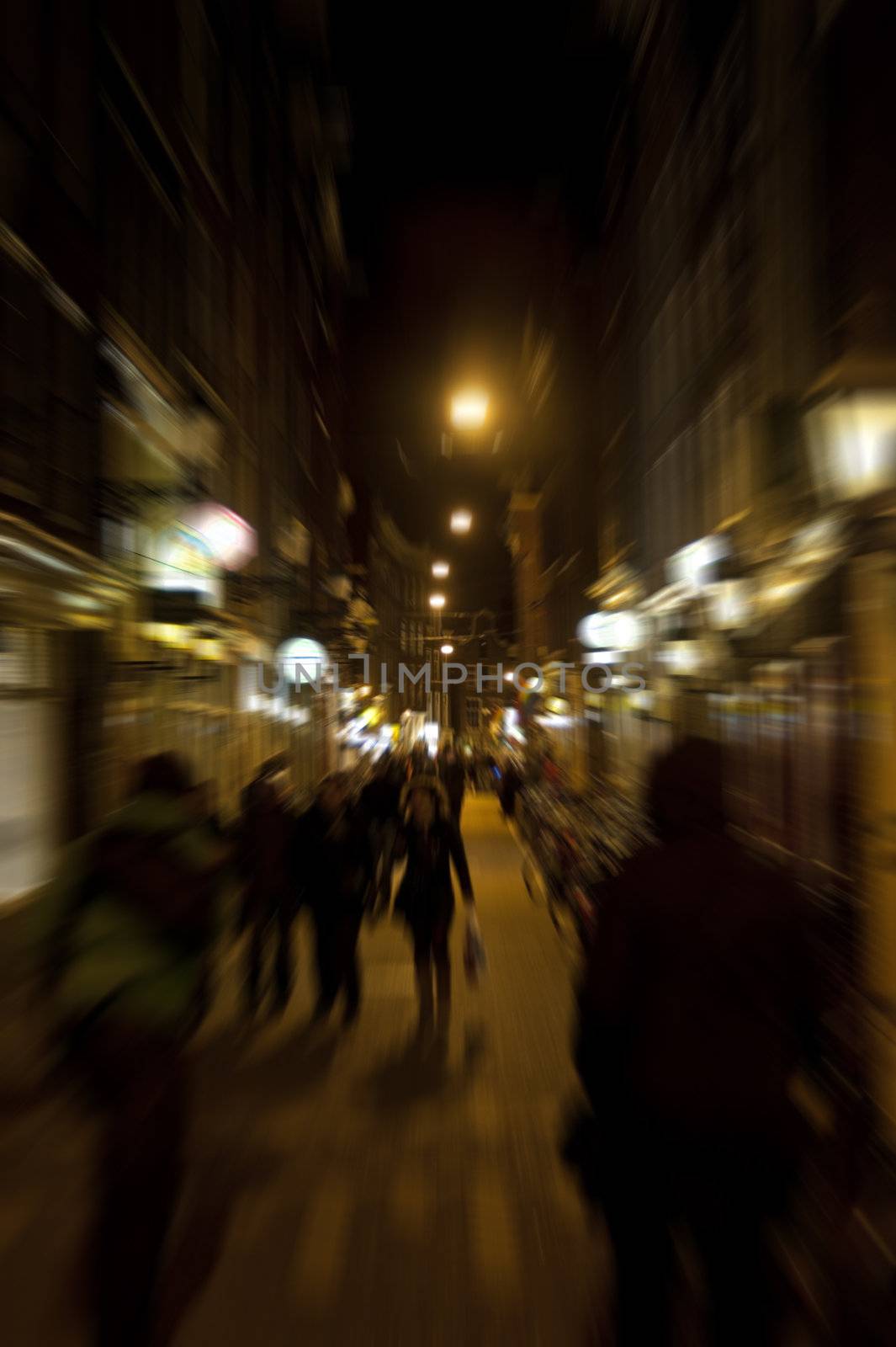 scene in the old town of amsterdam, netherlands by night