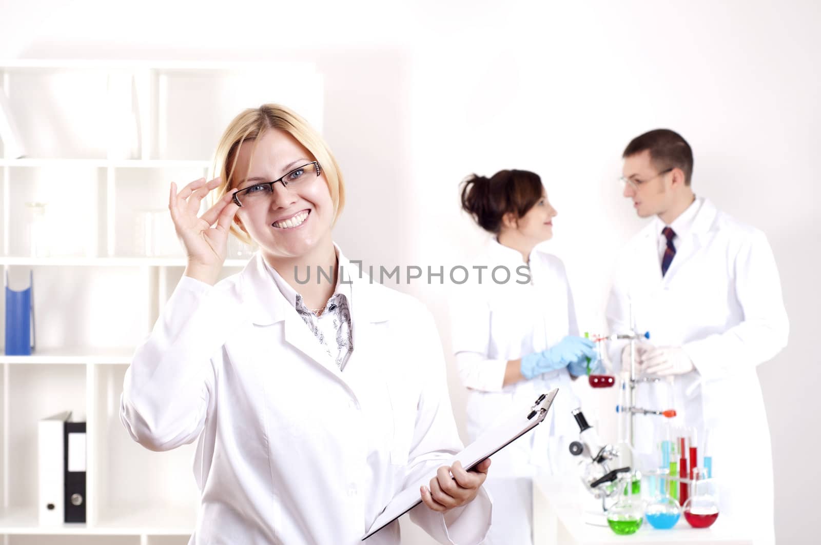 portrait of doctor, holds a tablet in the office