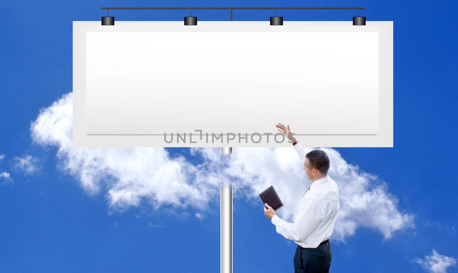 The successful businessman against a publicity board and the bright blue cloudy sky by sergey150770SV