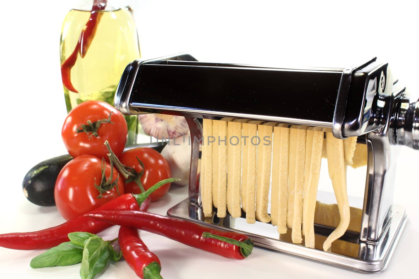 a pasta machine with homemade noodles