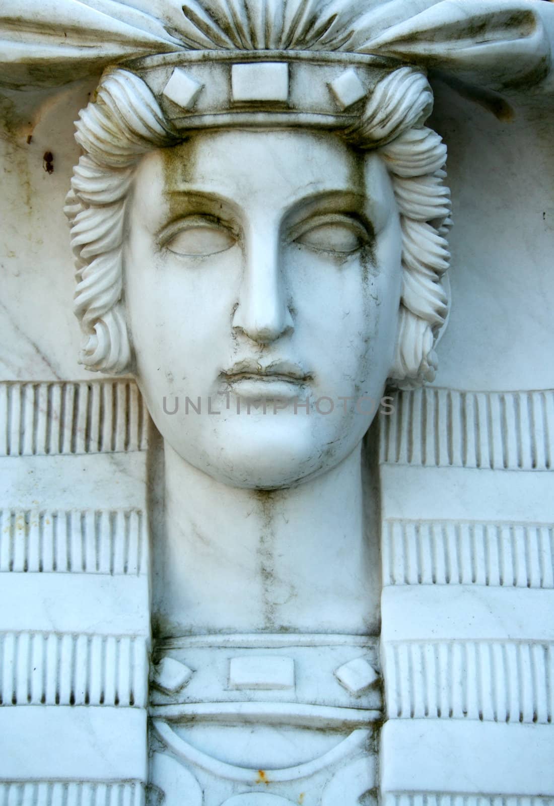 A close up of a statue face