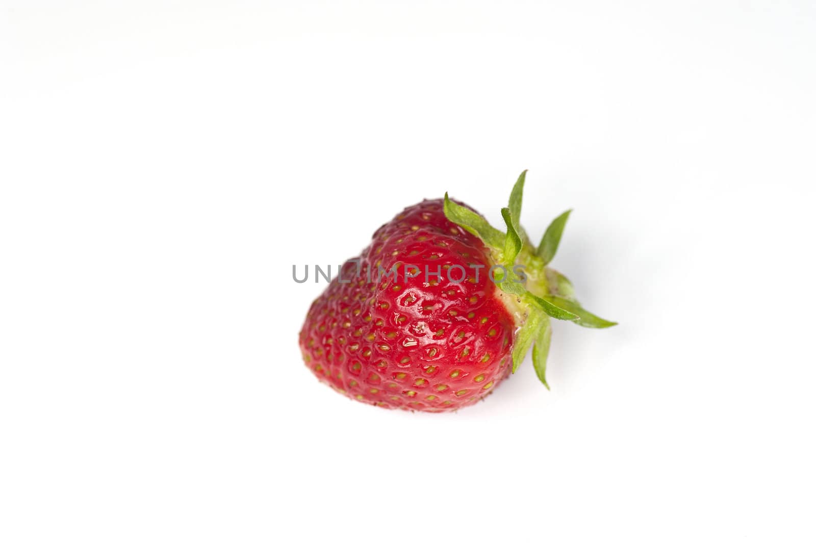 Closeup of a single strawberry on a white background