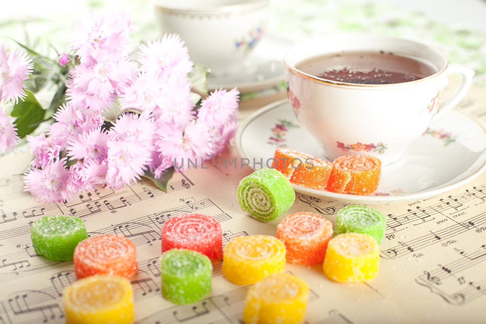 Candied fruit jelly with tea with flower