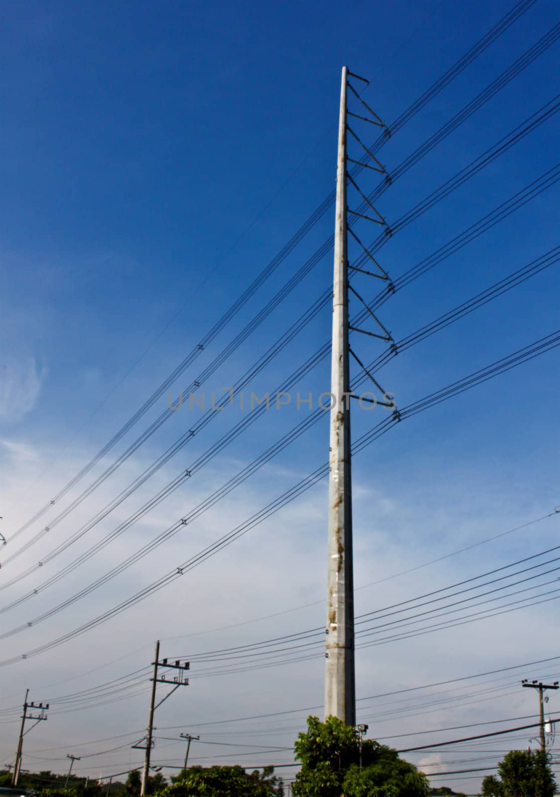 High and low metal posts with power line cables for electrical distributions to consumers.