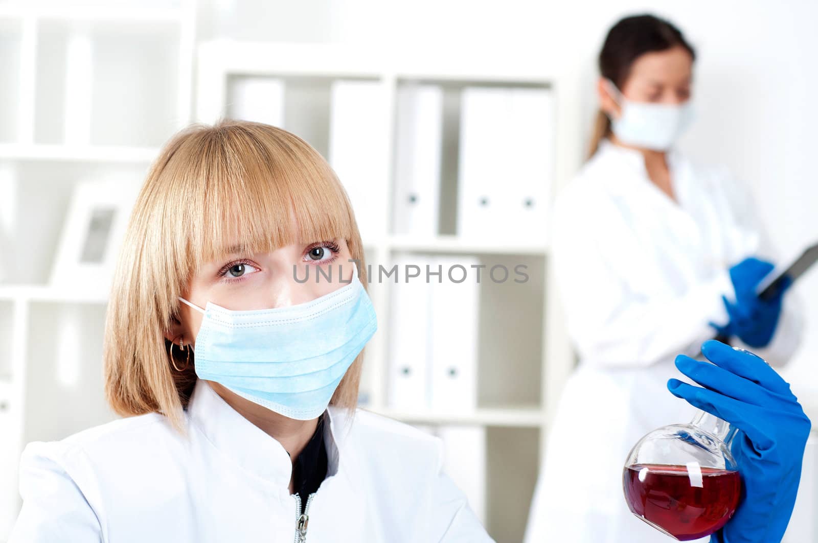 group of scientists working in laboratories with equipment