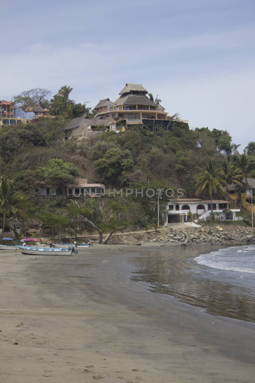 A beach in Mexico with large homes by jeremywhat