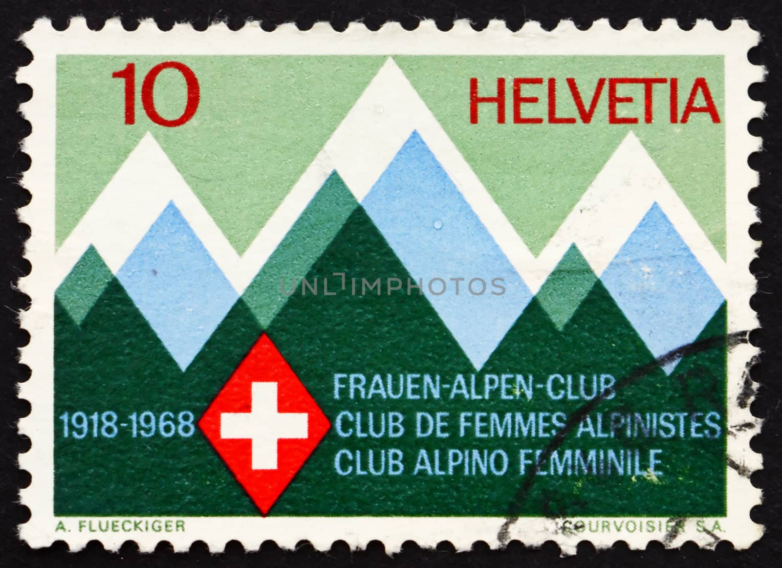 SWITZERLAND - CIRCA 1968: a stamp printed in the Switzerland shows Mountains and Emblem of the Swiss Women�s Alpine Club, 50th Anniversary, circa 1968