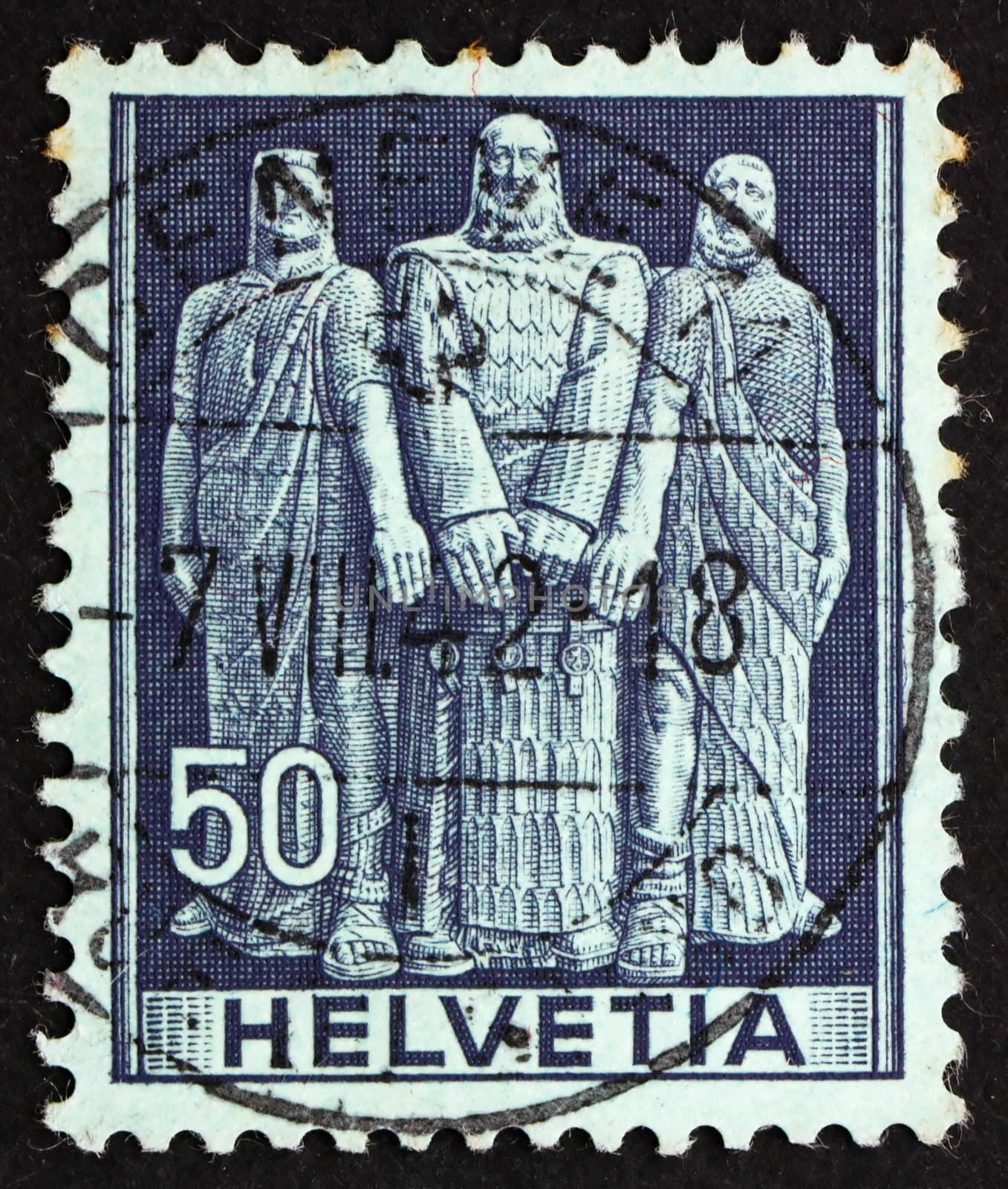 SWITZERLAND - CIRCA 1941: a stamp printed in the Switzerland shows The Three Swiss, Oath on Rutli Mountain, 1291, the Birth of the Old Swiss Confederacy, circa 1941