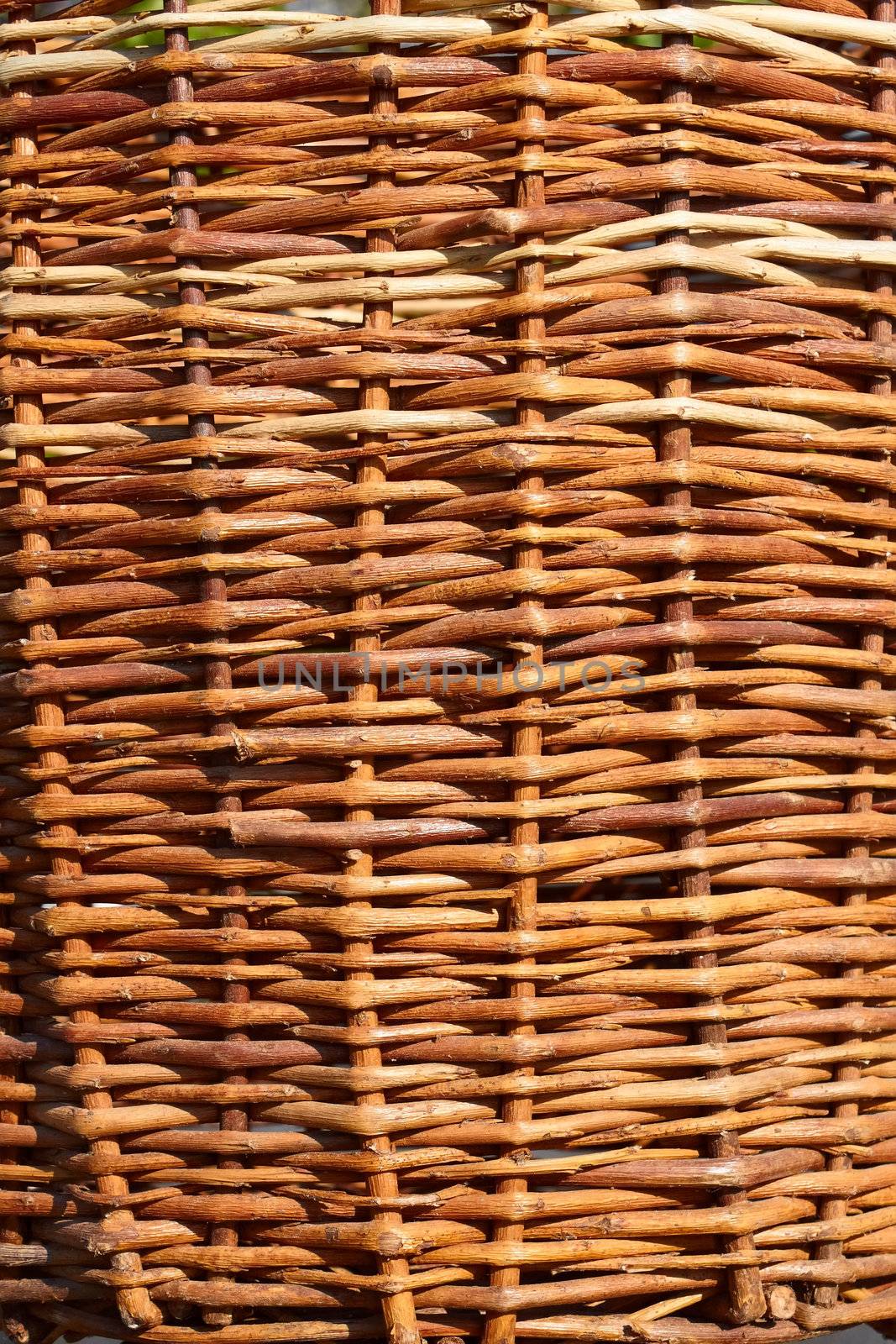 Detail of wicker basket with willow twigs by qiiip
