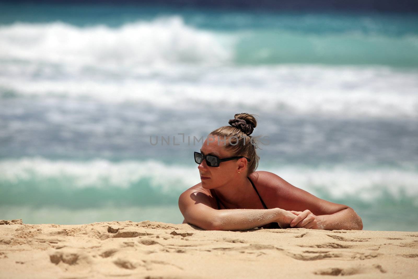 The girl in a sunglasses at coast of the sea. Barbados