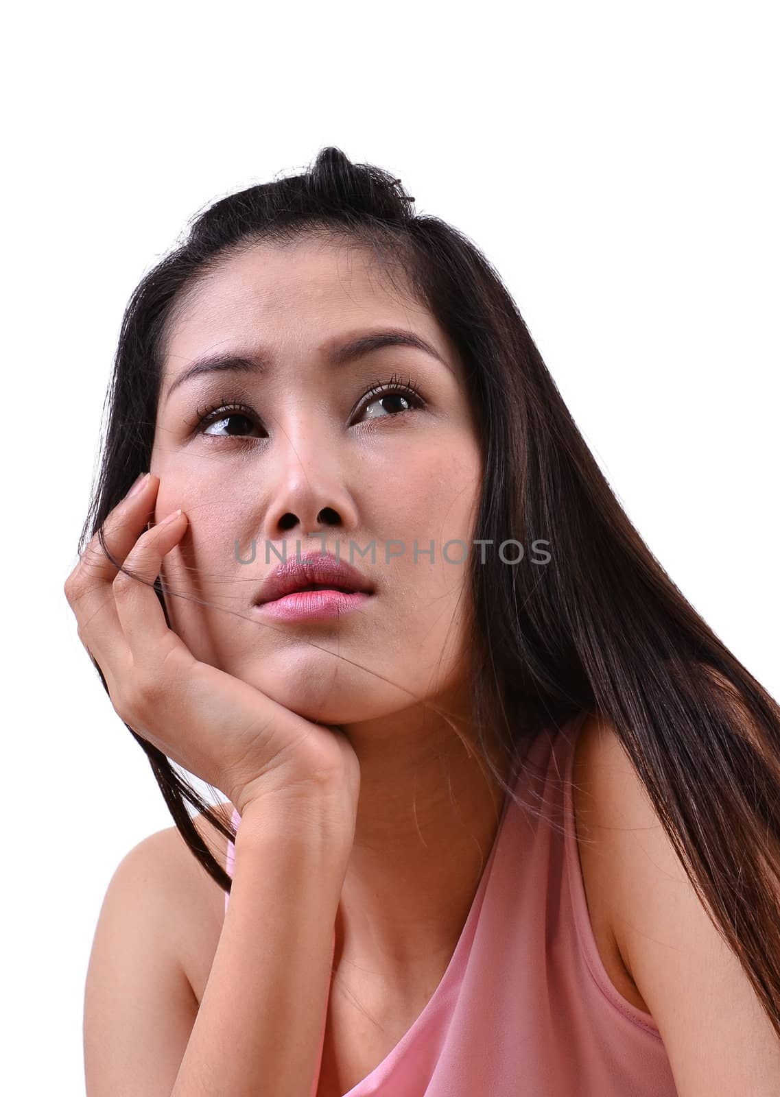 Sad beautiful woman standing against a white background