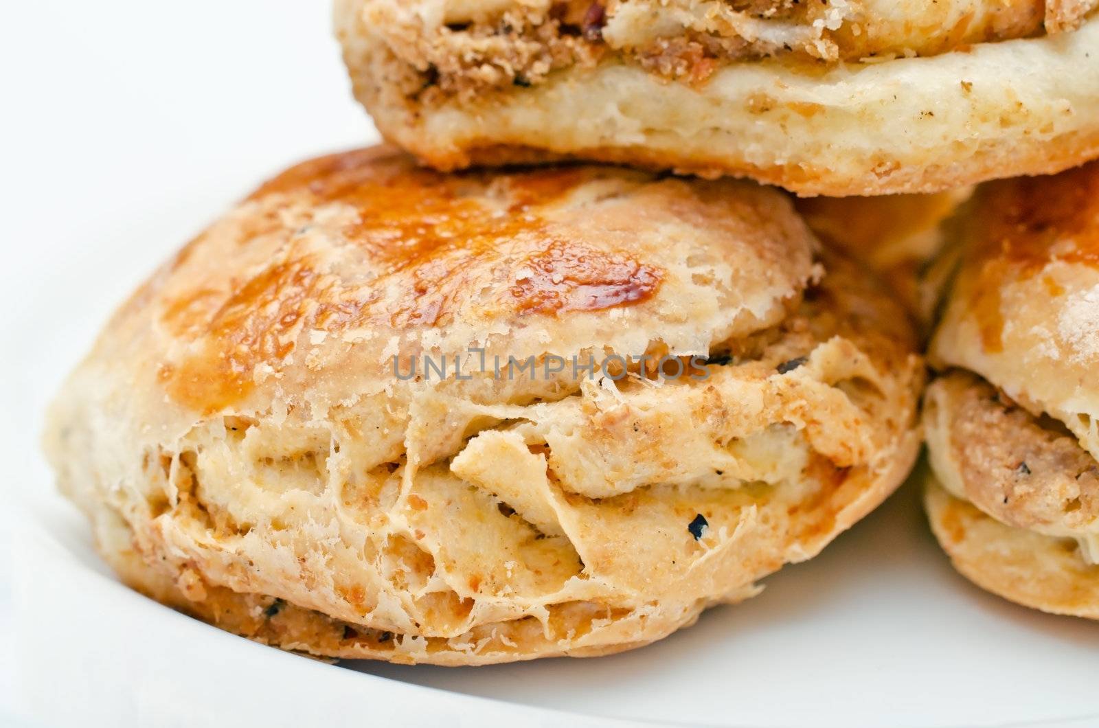 Pork Rind biscuits on the plate, high key, shallow DOF