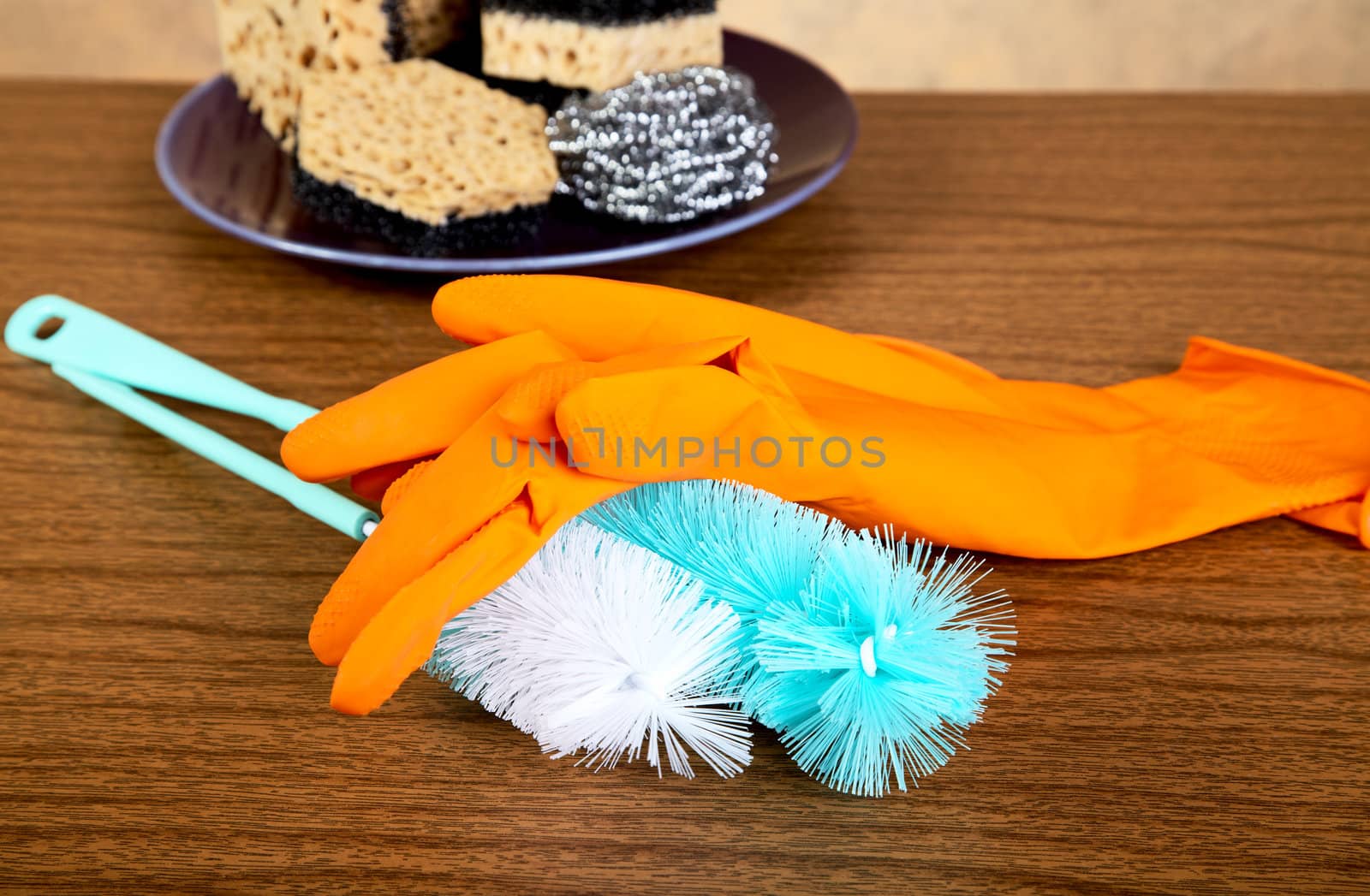 Gloves ,sponge, brush for ware washing on a table