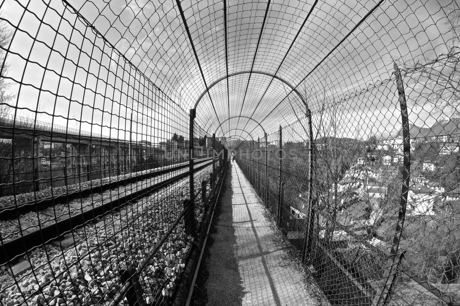 long pedestrian tunnel near by the train railway in Belluno