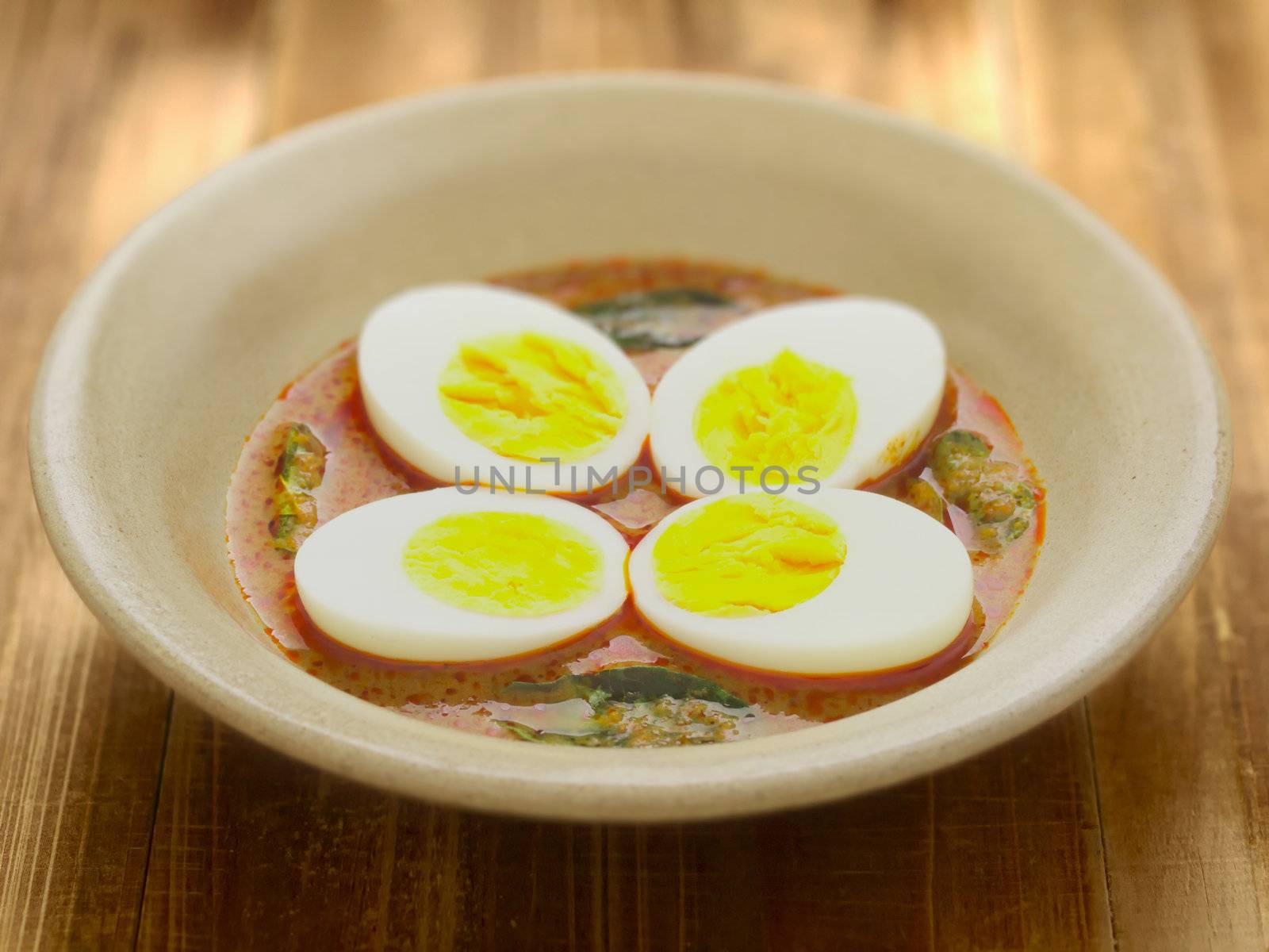 close up of a bowl of indian egg curry