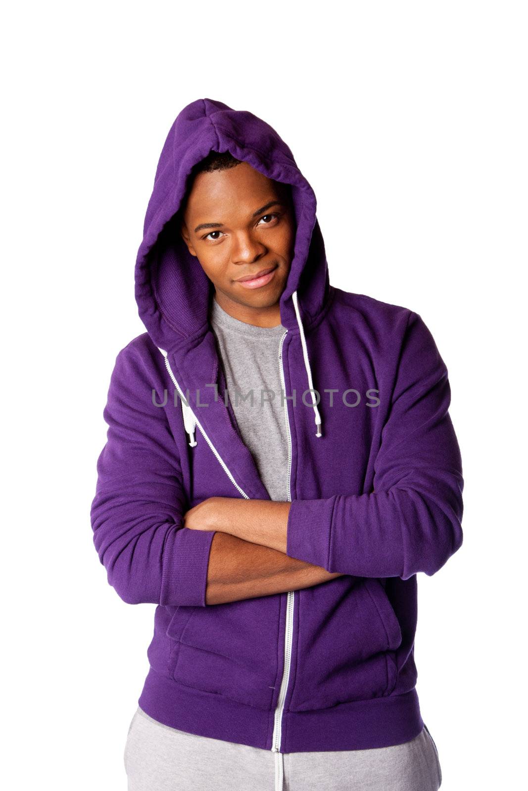 Young handsome man ready for sports wearing purple hooded sweatshirt and gray training pants, isolated.