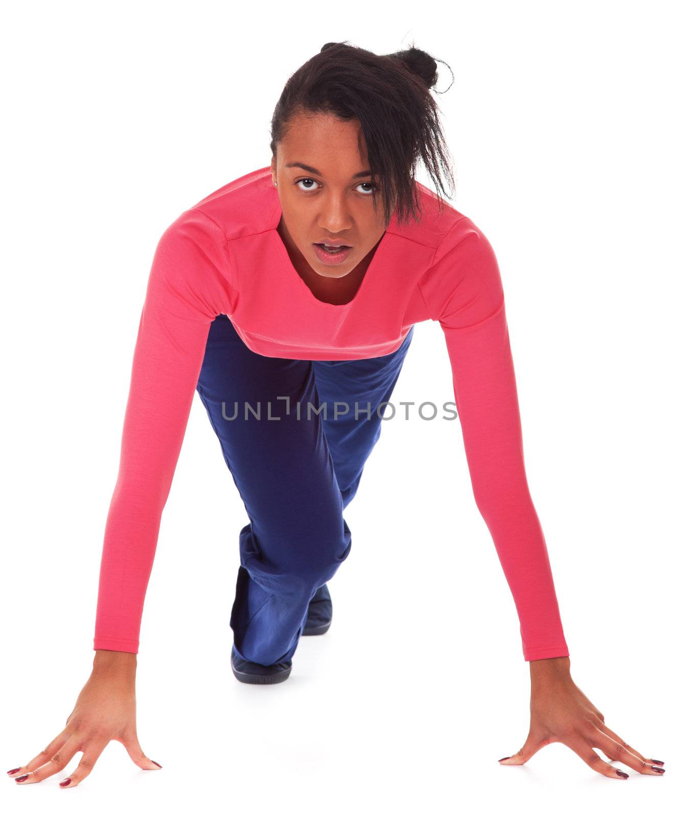Female athlete in position to start running, isolated on white background
