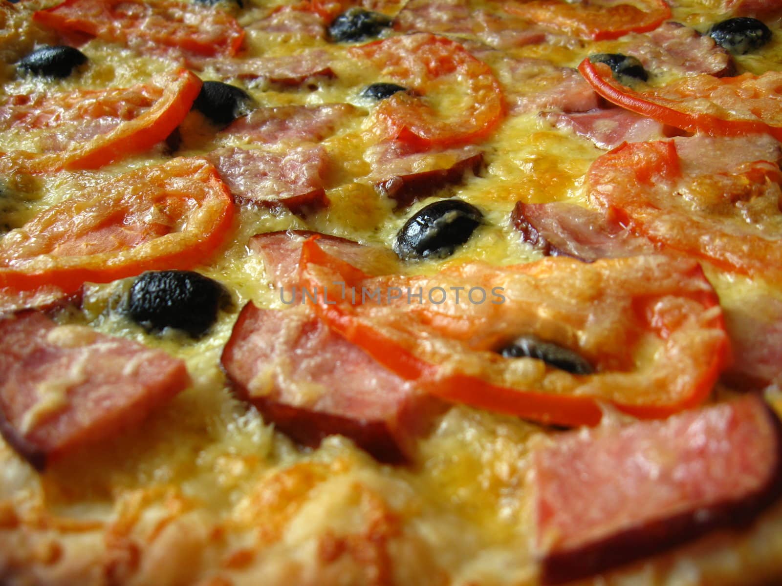 The image of tasty pizza with an appetizing stuffing