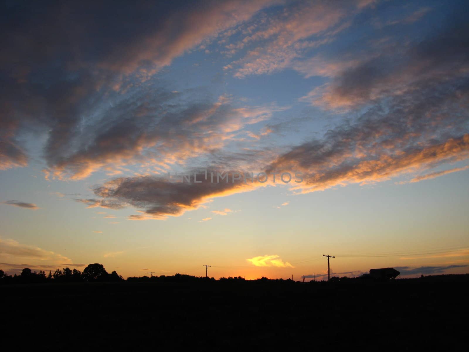 The landscape with beautiful picturesque clouds and sunset