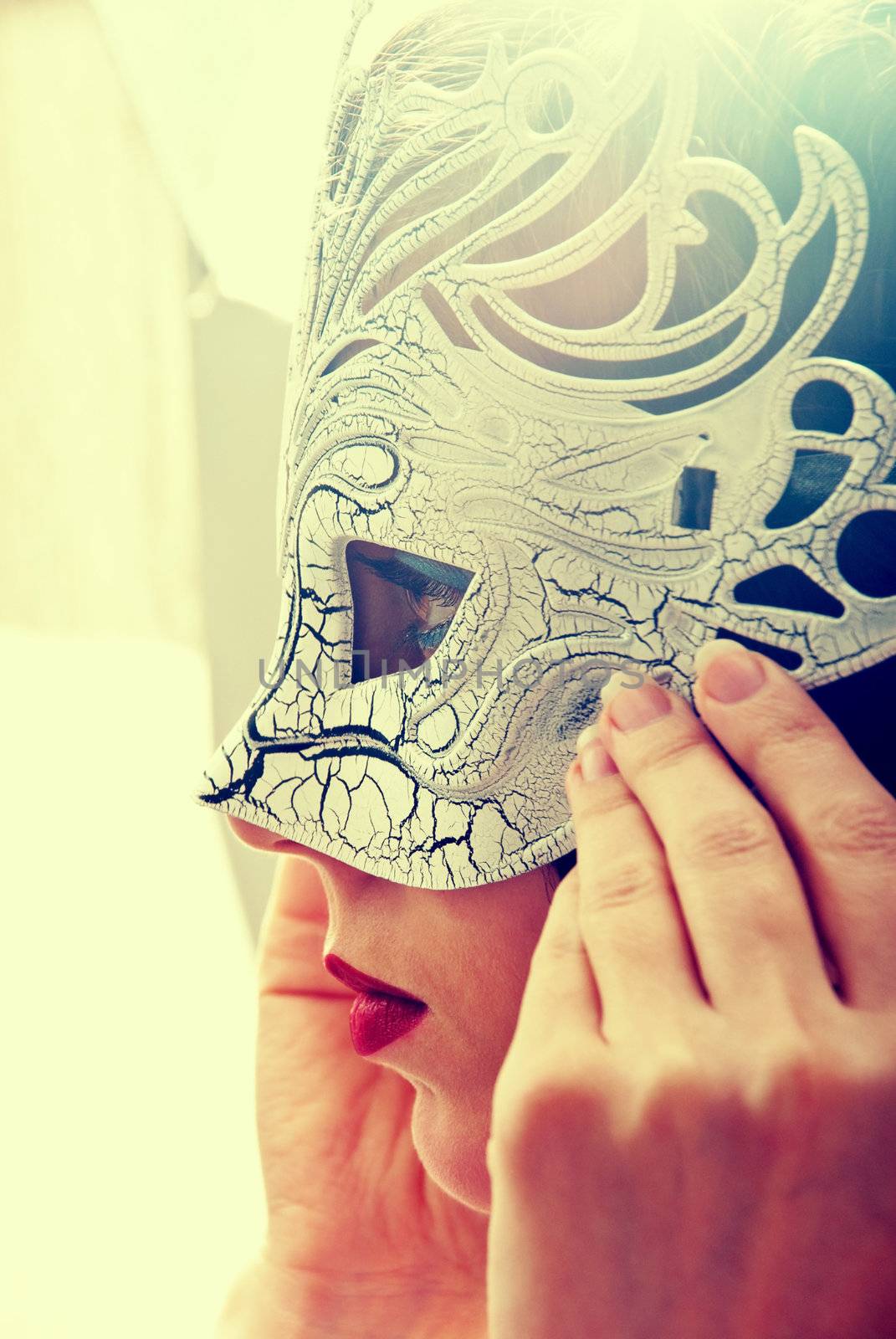 Sexy woman in masquerade mask in vintage style