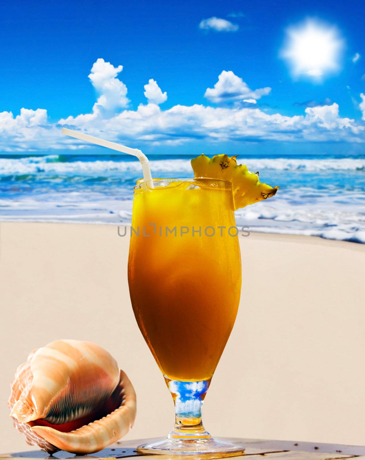 Tropical fruit cocktail and sea shell