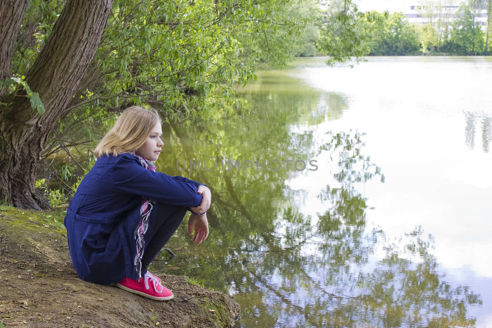  little girl sitting by the water  by miradrozdowski