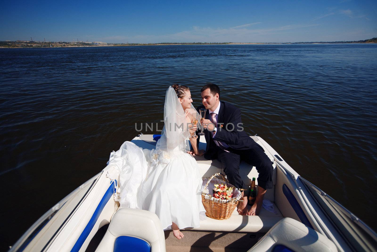 happy young couple having picnic on the yacht
