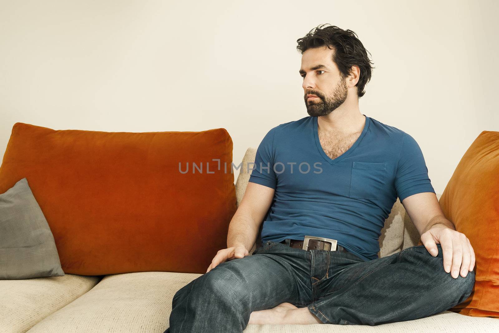 An image of a handsome but depressed man with a beard