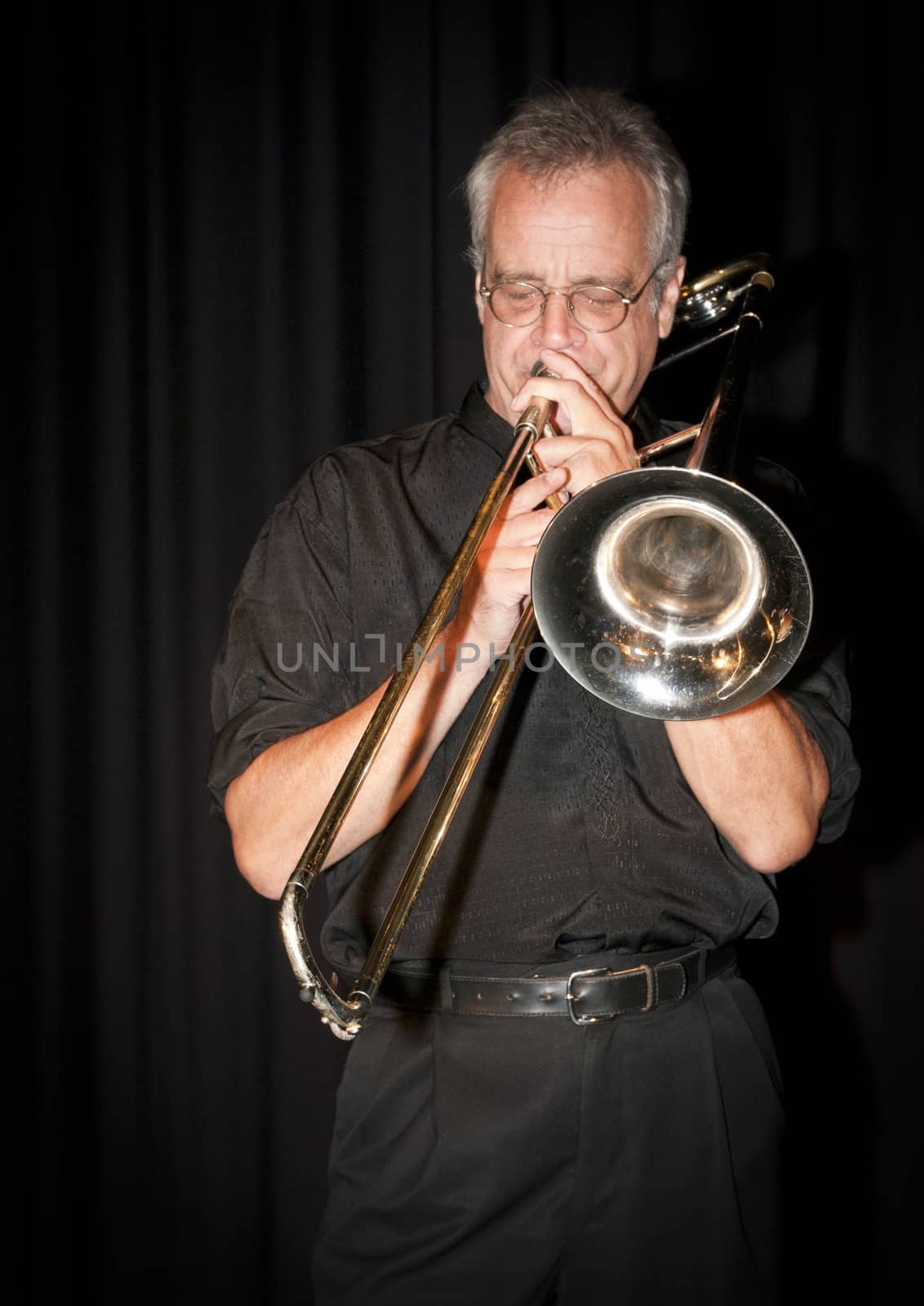 Trombonist Dave Arthur playing at the Art Centre in Ottawa, Canada.