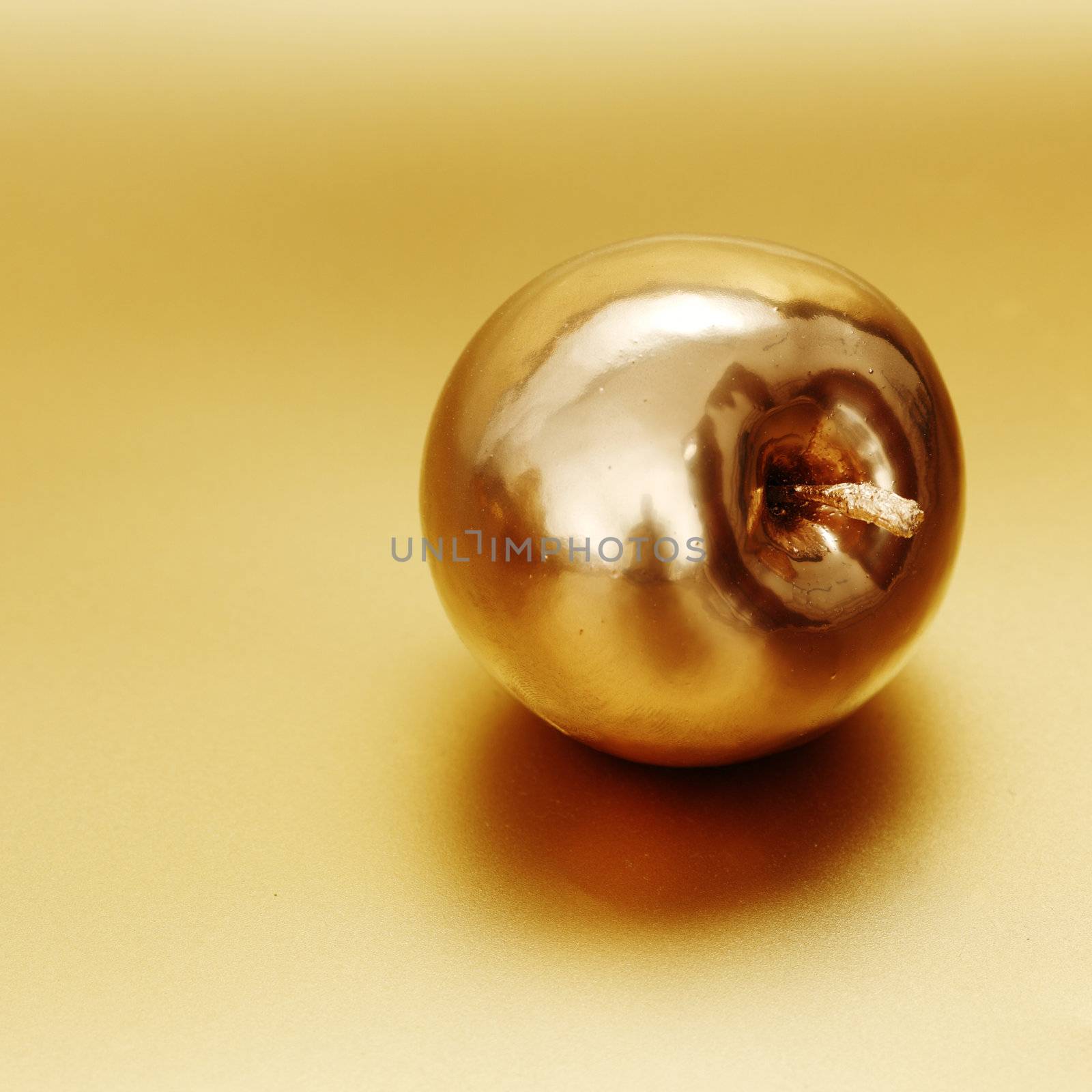  gold apple on gold background