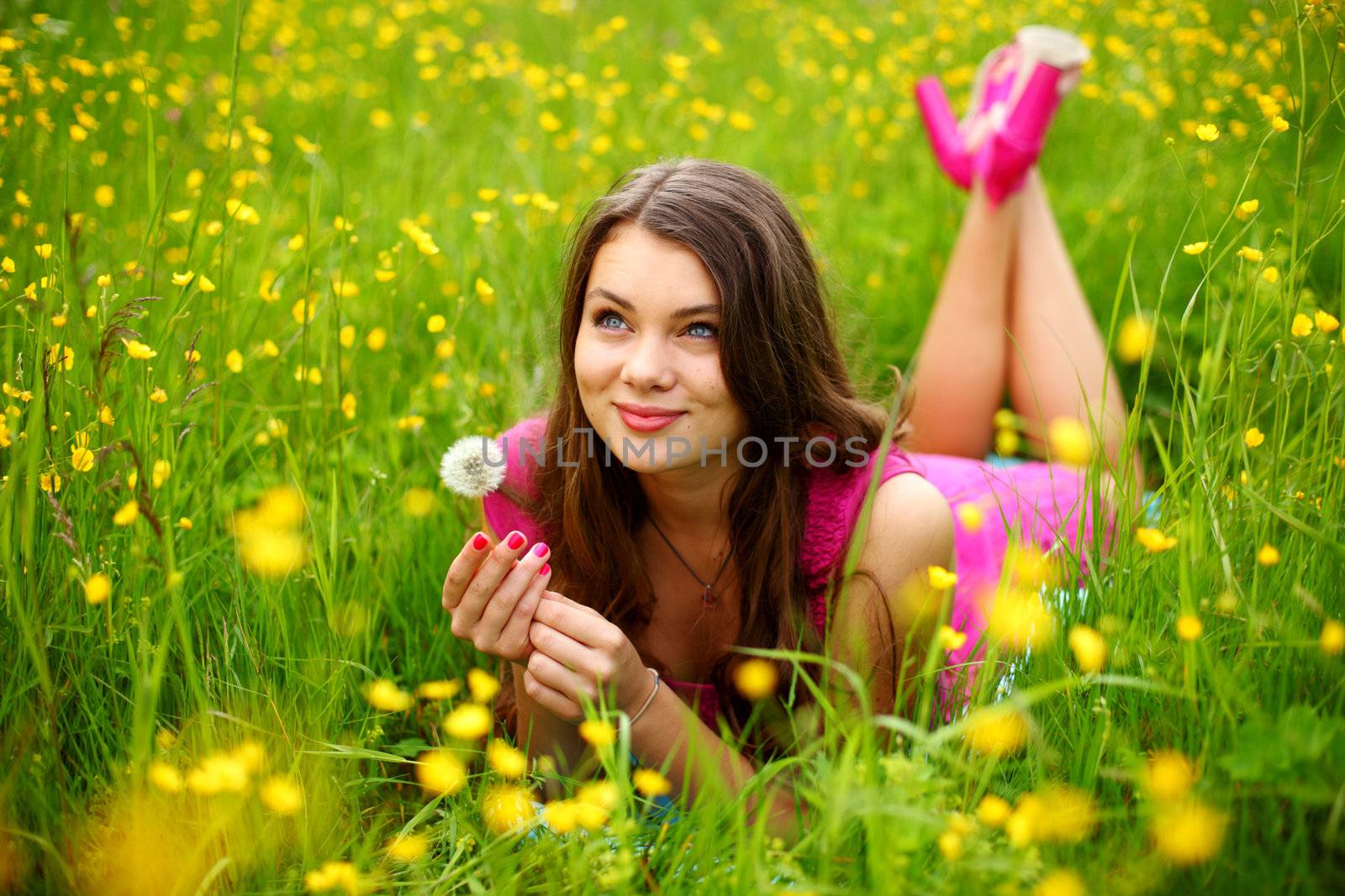 summer woman blow on dandelion 