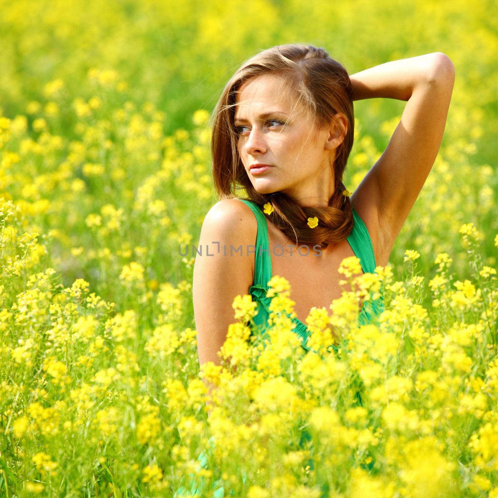 woman on oilseed field close portrait