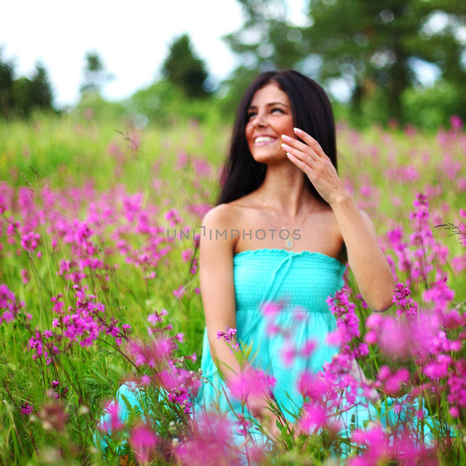 woman on pink flower field close portrait