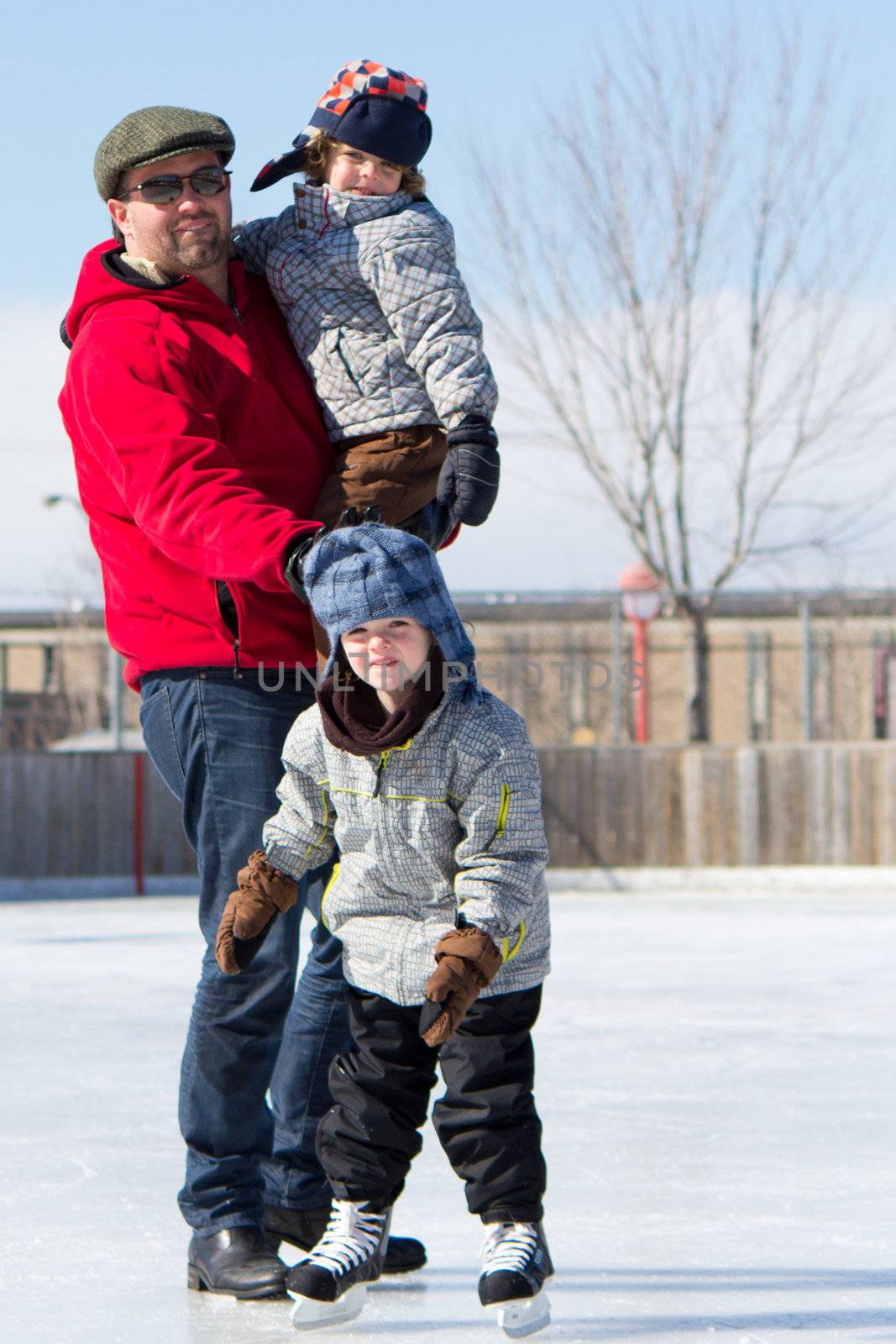 Happy family at the skating rink by bigjohn36